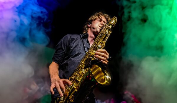 saxophone player with coloured lights