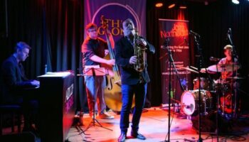 band on stage at The Globe