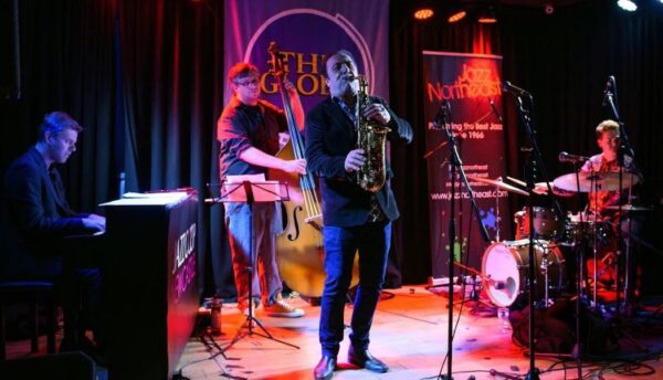 band on stage at The Globe