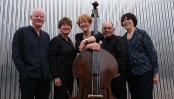 five members of the band with double bass