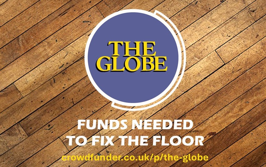 Globe logo on wood floor