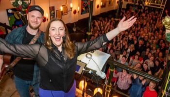 Abi Moore and a crowd of singers