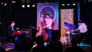 The trio playing at The Globe
