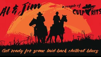 two cowboys on horses with setting sun