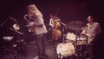 four musicians on stage