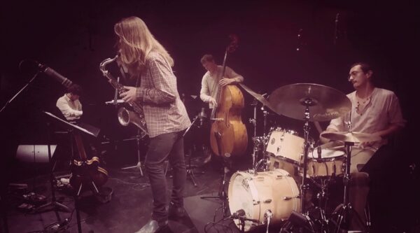 four musicians on stage