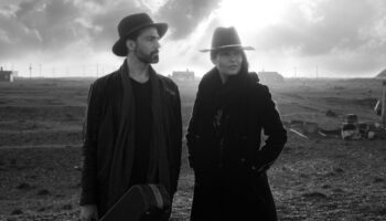 Mono photo of Jo and Jamie outdoors in open country