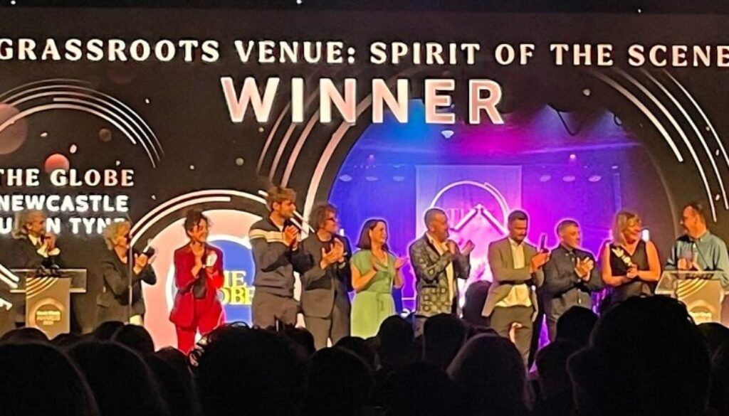 Finalists on clapping on stage